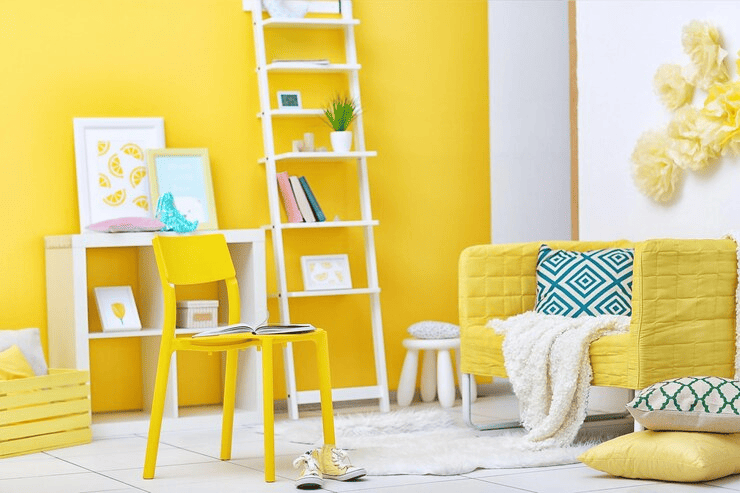 a yellow chair and a yellow chair in a room